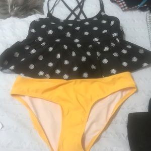 Two piece swimsuit miss matched top and bottom .
